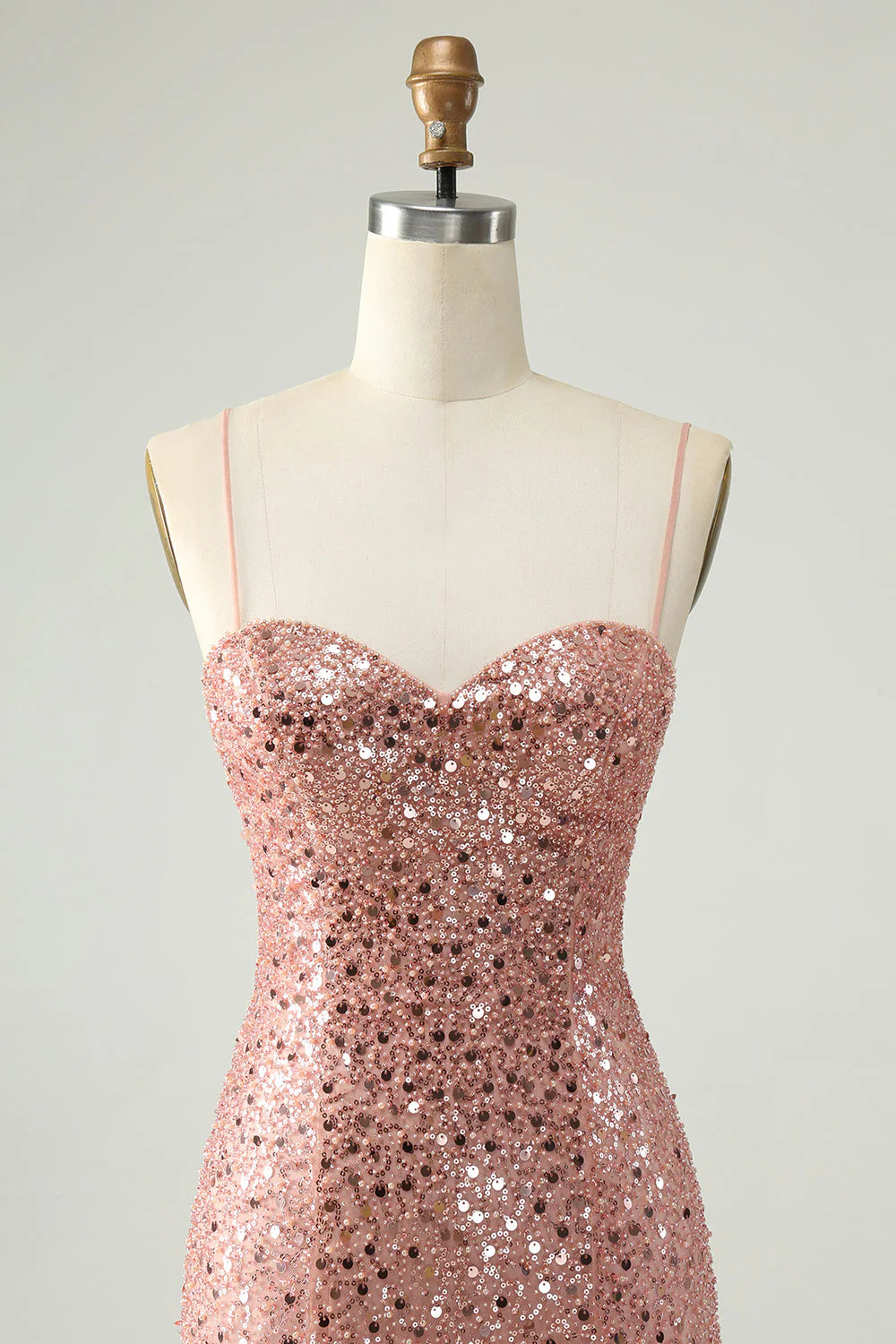 Close-up of the sequin detail on a blush A-line cocktail dress.