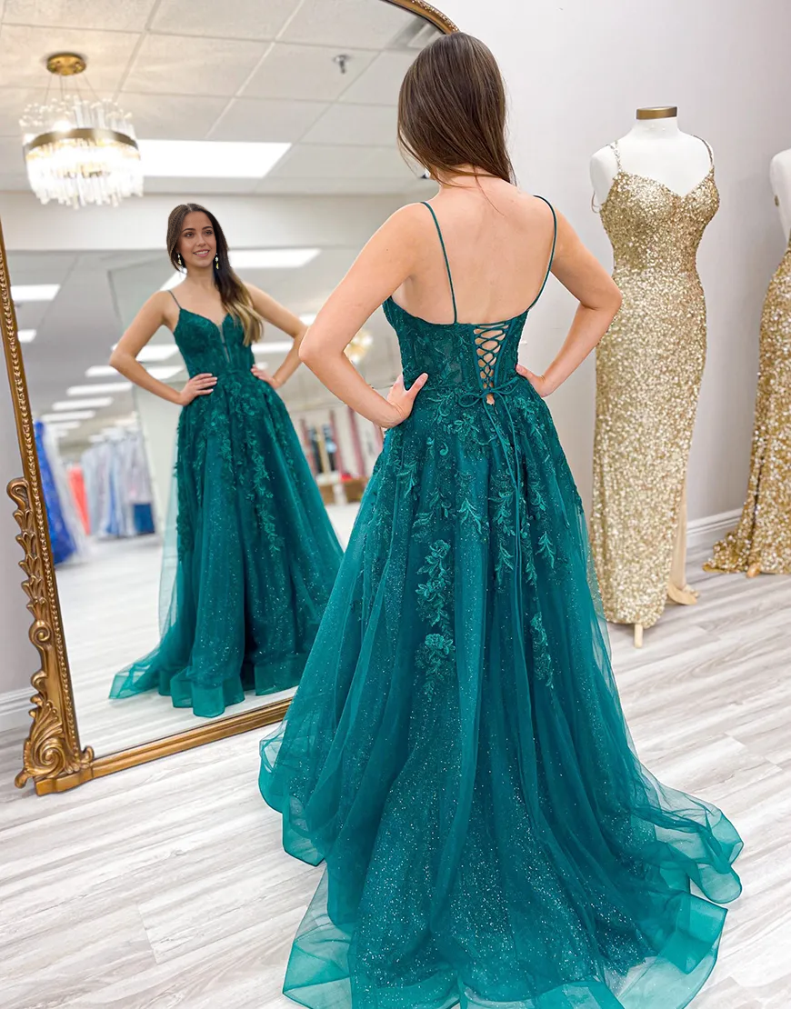 Back view of the emerald green A-line dress, showing corset detailing.