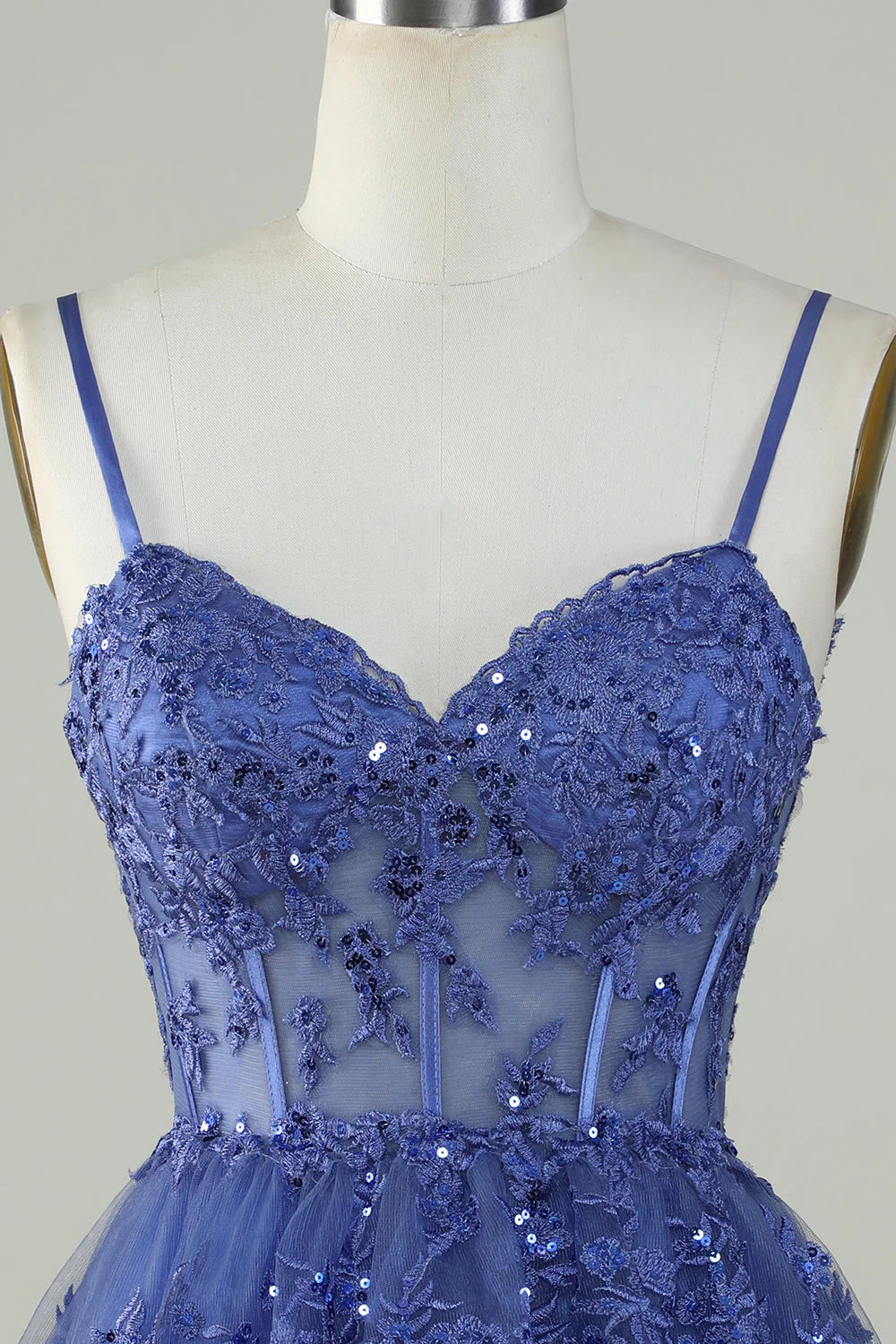 Side view of elegant dark blue sparkly party dress.