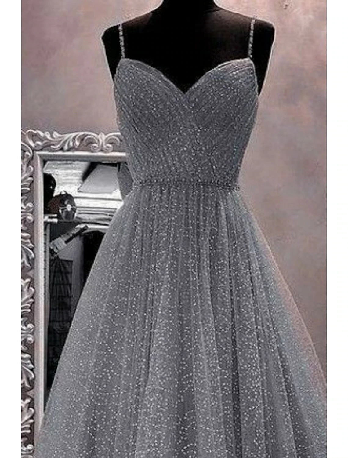 Back view of a shimmering A-line dress for formal occasions.