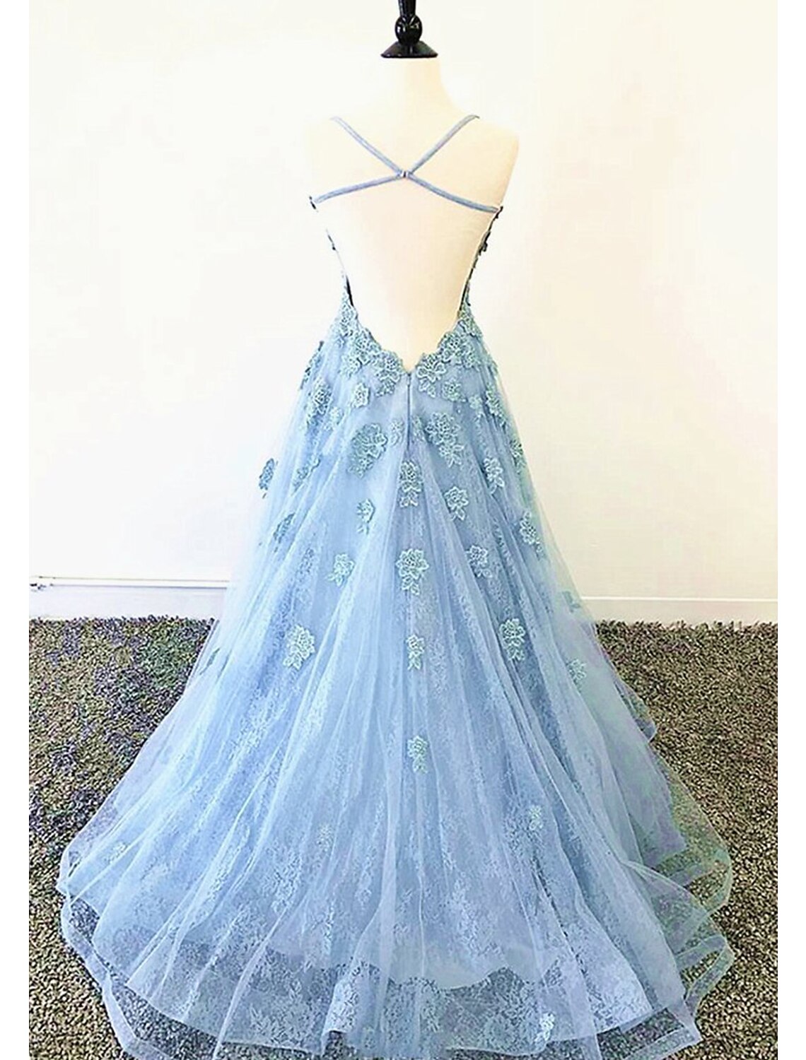 Side view of the sparkly A-line evening dress, showcasing the flowing tulle and pleated skirt.