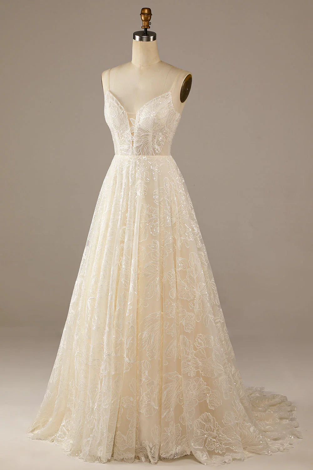 Side profile of the ivory sparkly A-line wedding dress, showcasing its silhouette and lace texture.
