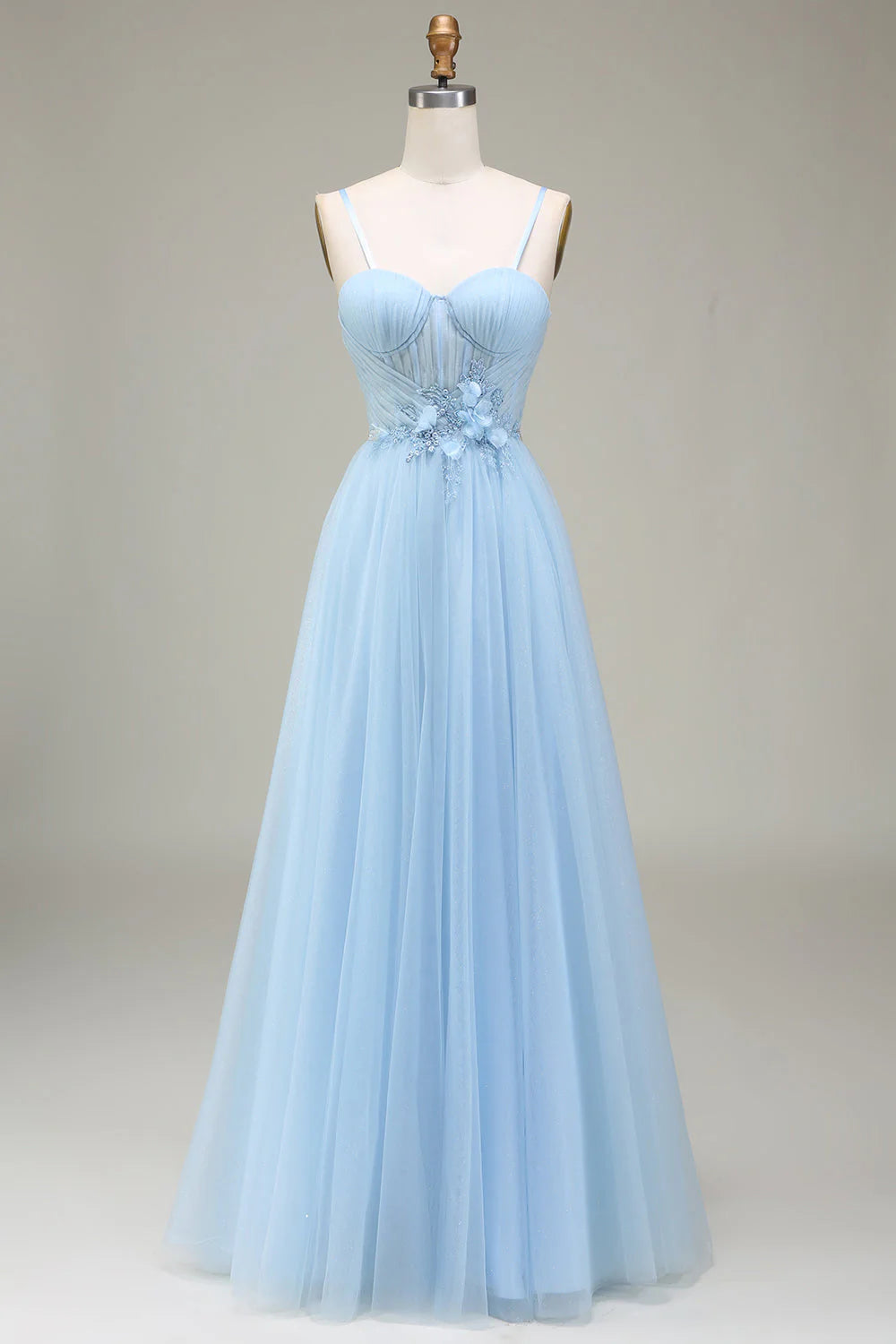 Front view of a model wearing a sparkly A-Line tulle prom dress with elegant appliques.