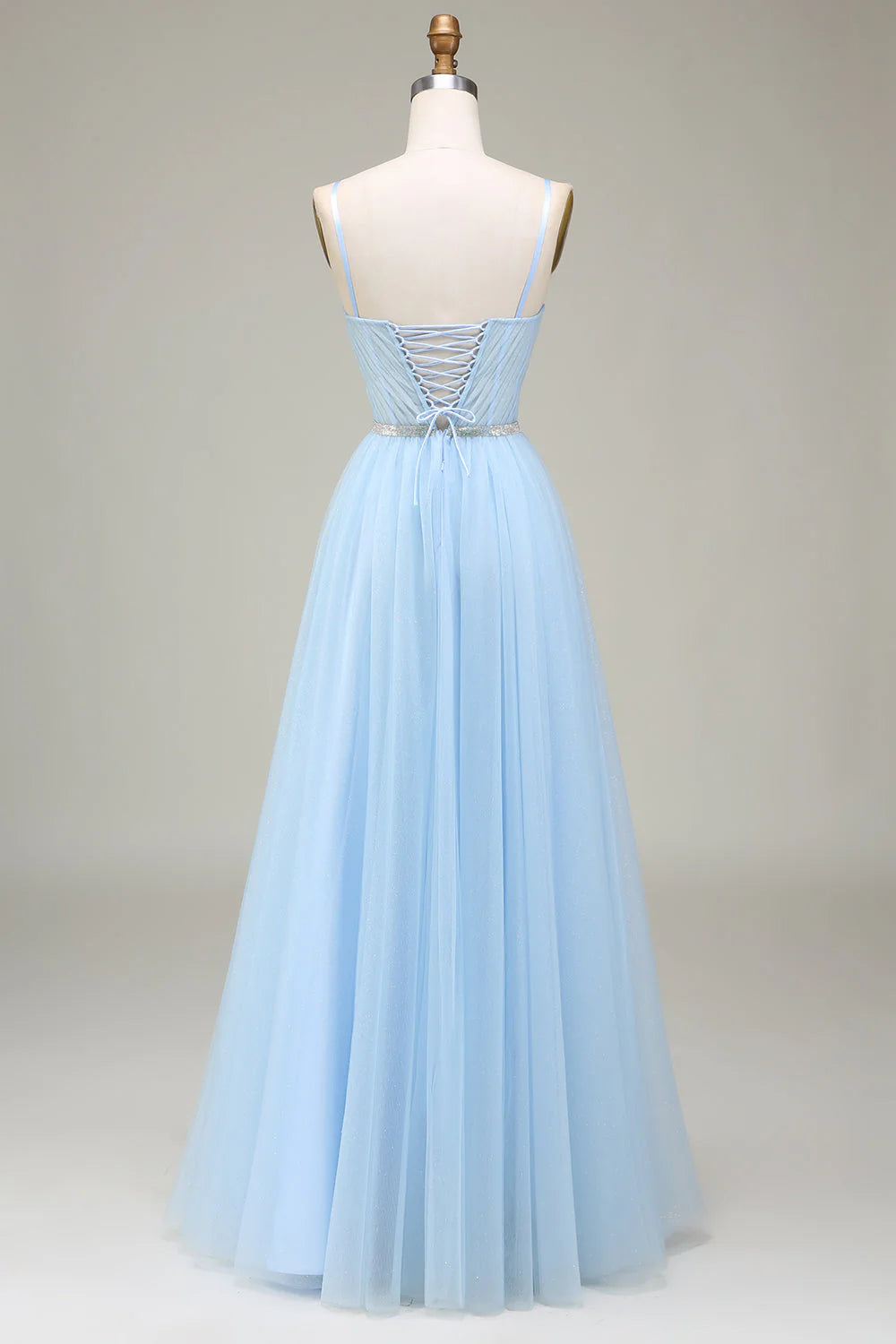 Side view of the elegant sparkly A-Line tulle prom dress, showcasing the flowing skirt.
