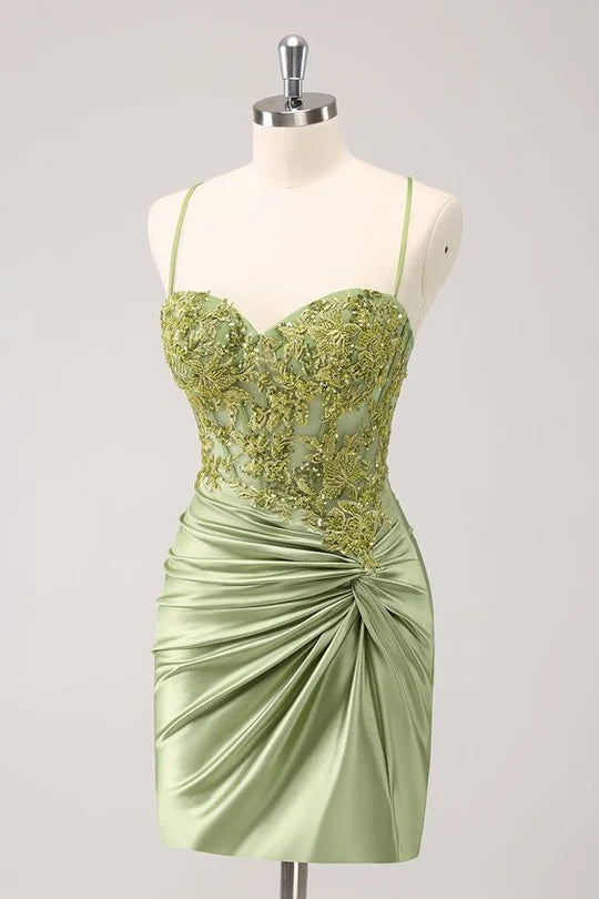 Front view of a sparkly A-line V-neck homecoming dress with appliques and pleated skirt.