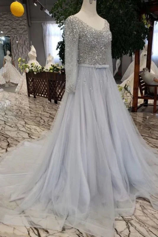 Side view of the elegant long sleeve prom gown.