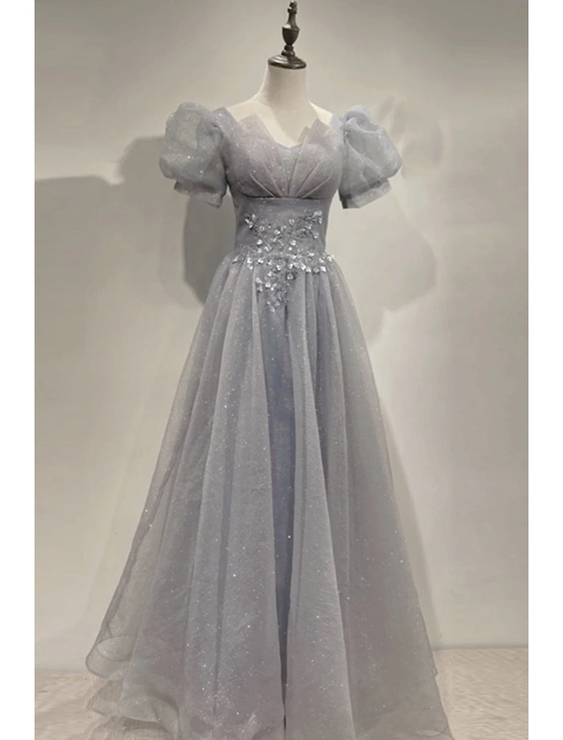 Sparkly A-Line V-neck prom dress with short sleeves and sequin tulle fabric.