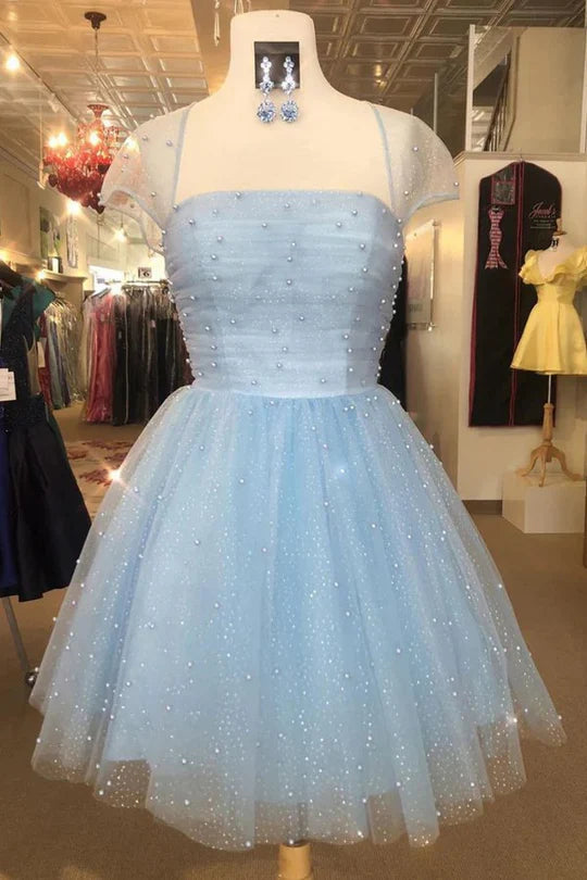 Sparkly short sleeve A-line tulle dress with V-neckline.