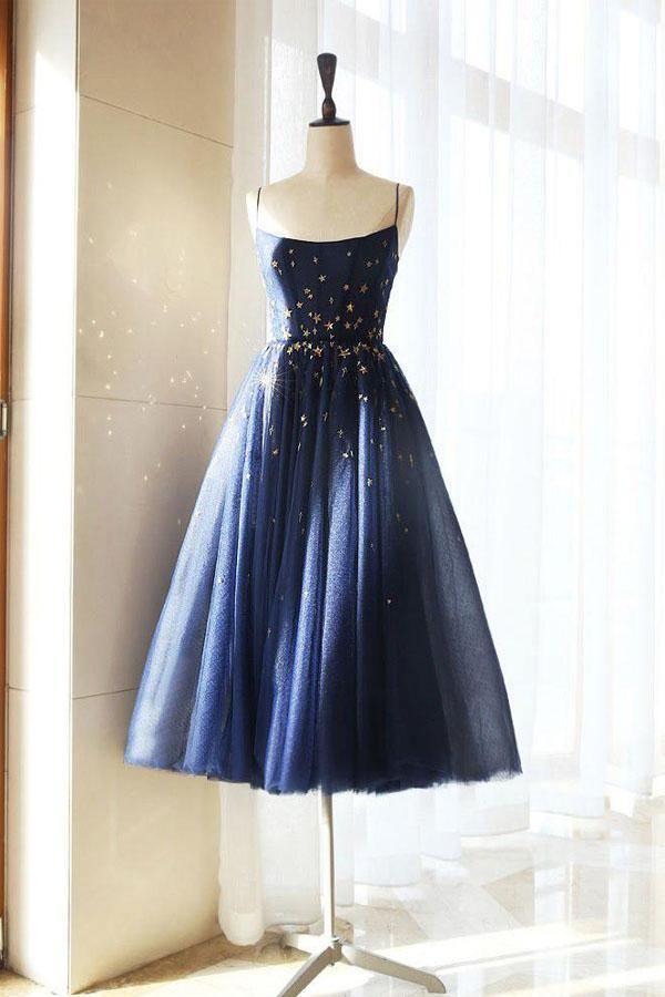 Sparkly A-line short homecoming dress with star details and V-neckline.