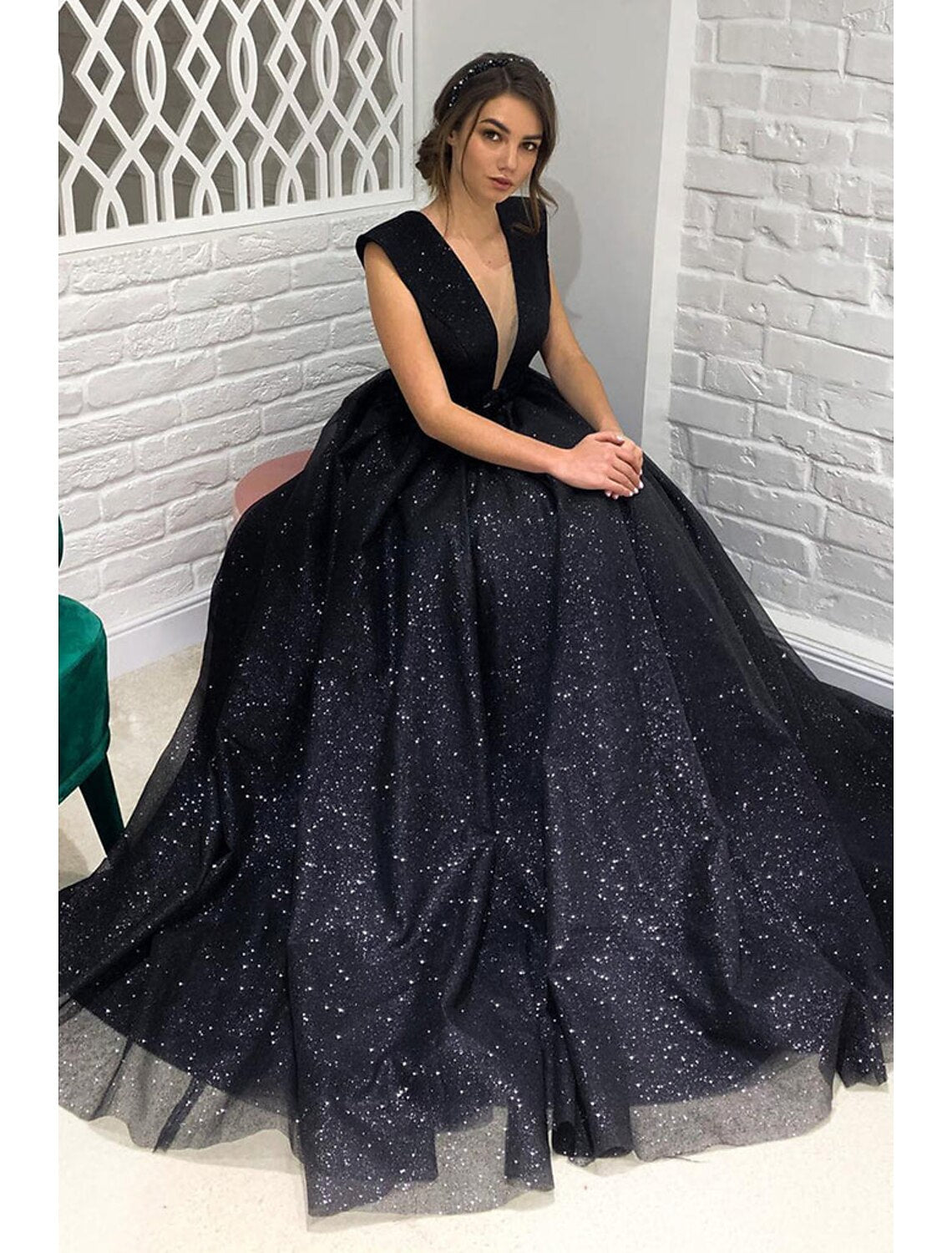 Sparkly A-line V-neck tulle ball gown with sweep train.