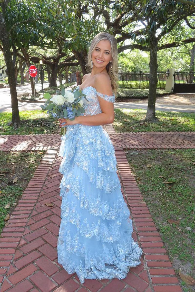 Side profile of the light blue A-line prom dress, highlighting the flowing tulle skirt.
