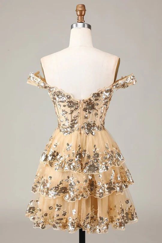 Back view of sparkly A-line V-neck mini dress with tiered skirt.