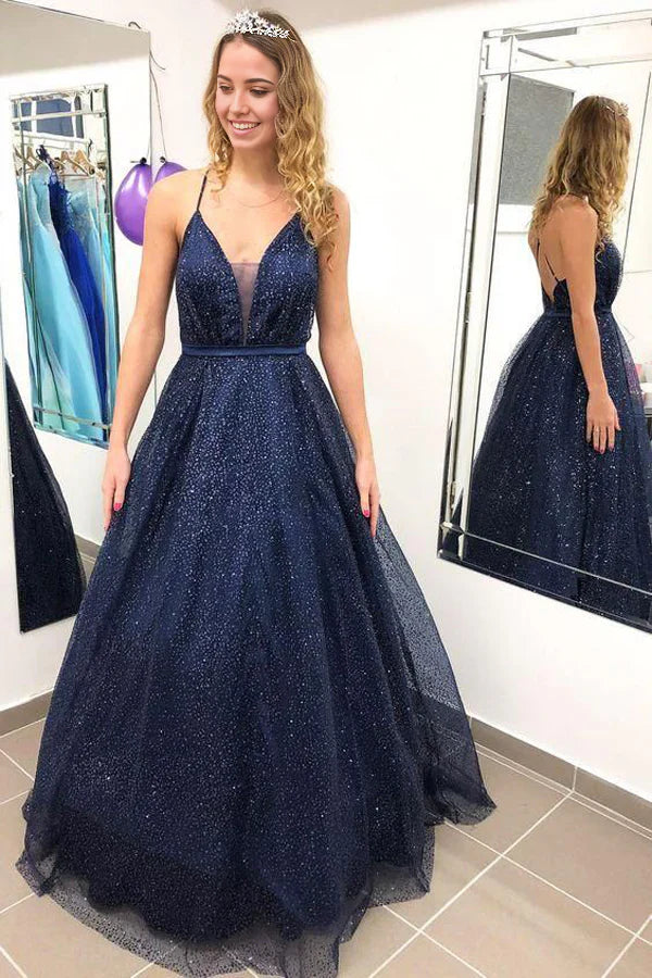 Sparkly V-neck ball gown with spaghetti straps and open back.