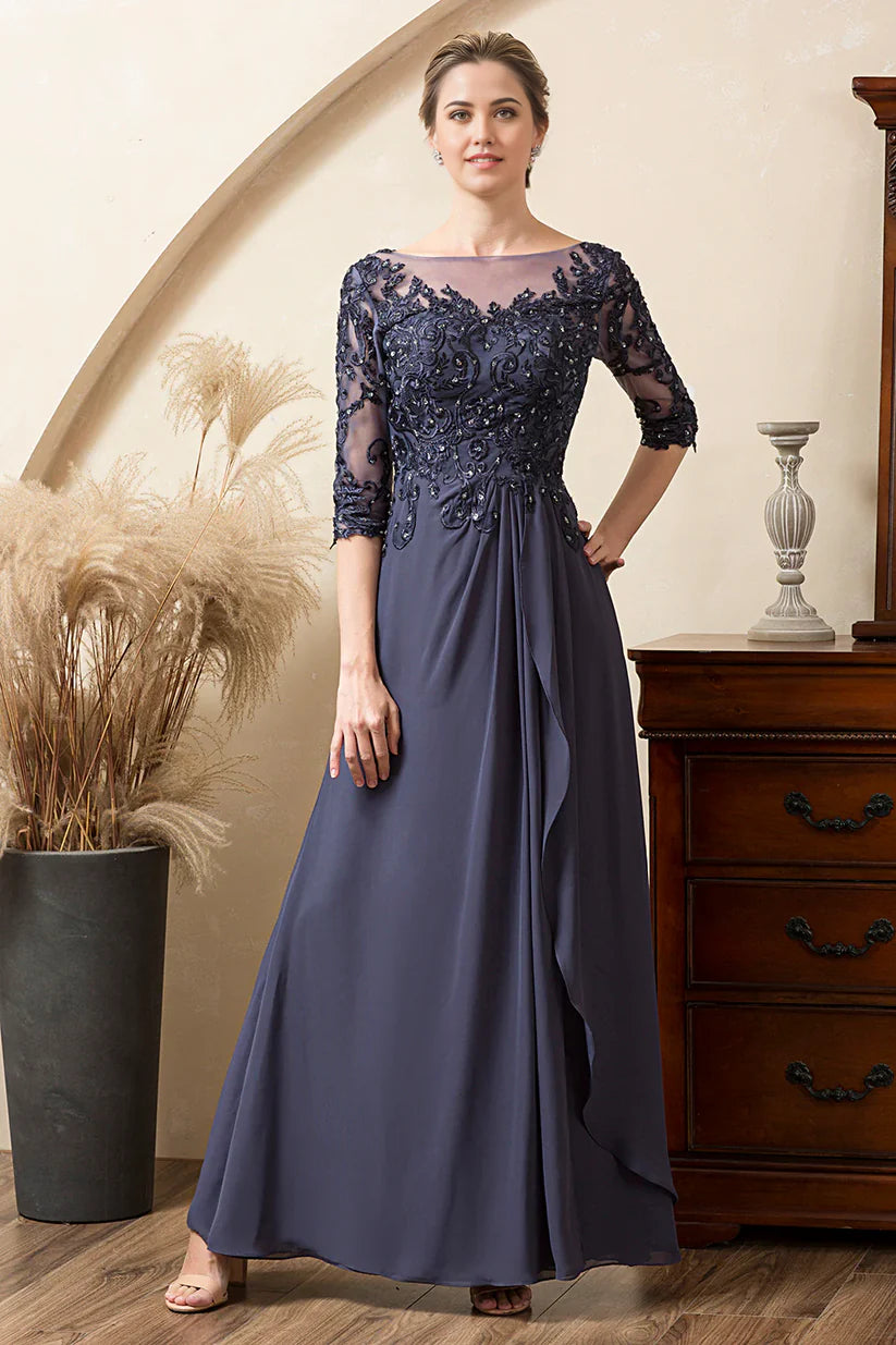 Woman wearing a blue sparkly beaded A-line chiffon Mother of the Bride dress.