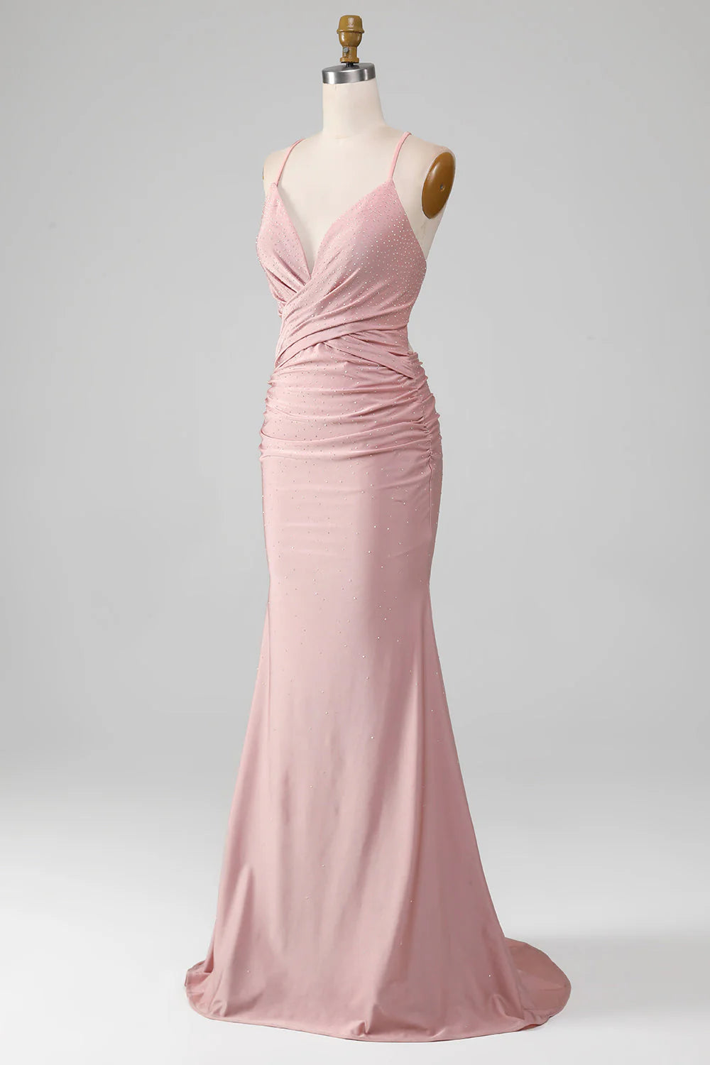 Close-up of the sparkly beading on a blush pink mermaid prom dress.