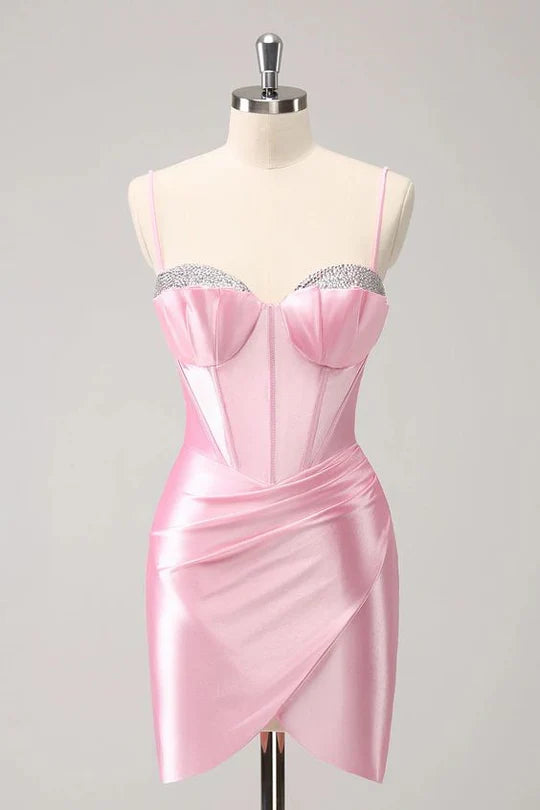 Model wearing a sparkly, beaded, tight V-neck spaghetti strap short homecoming dress.