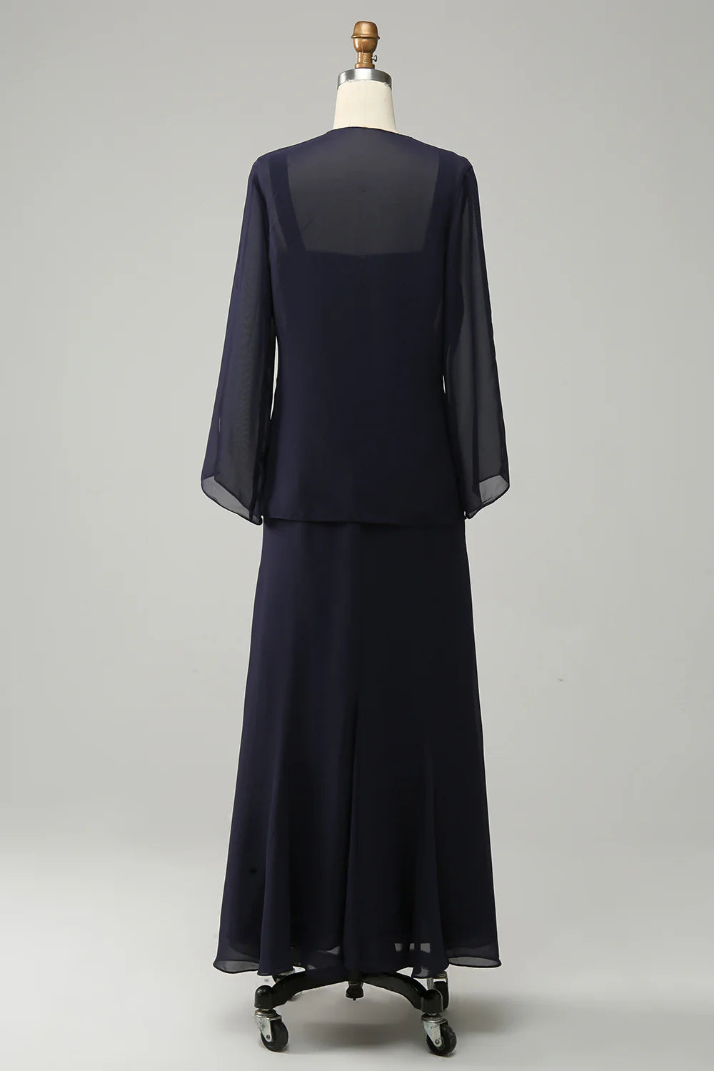 Side view of the navy blue two-piece sparkly beaded Mother of the Bride dress.