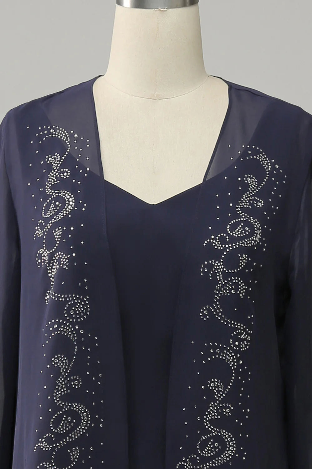 Close-up of sparkly beading on the navy blue Mother of the Bride dress.