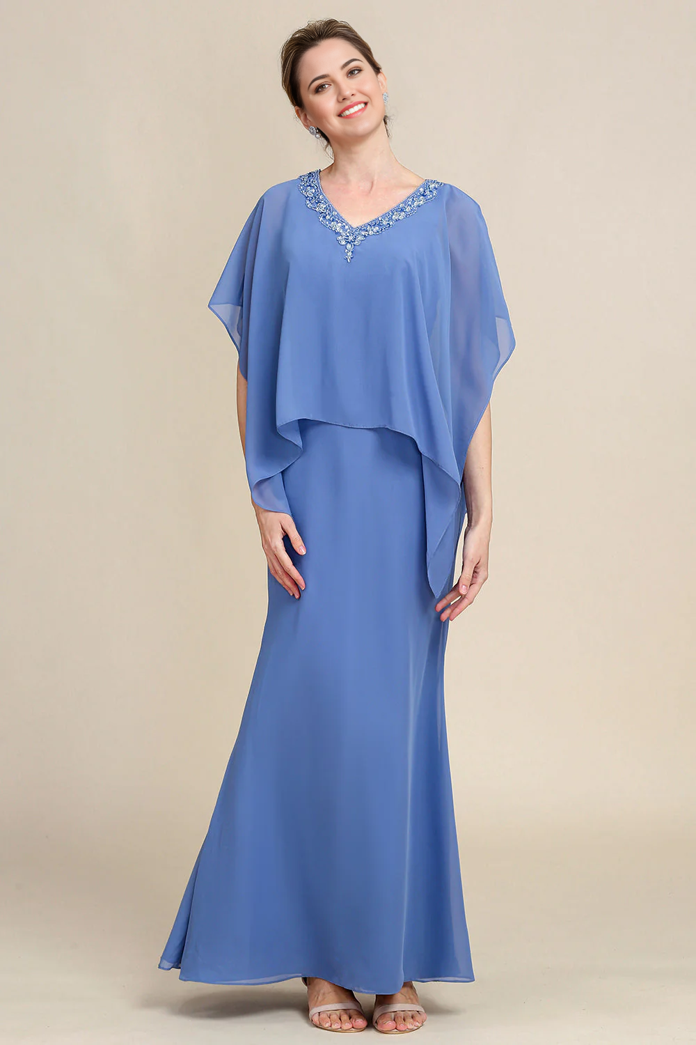 Elegant sparkly beaded A-line dress with batwing sleeves and V-neck.