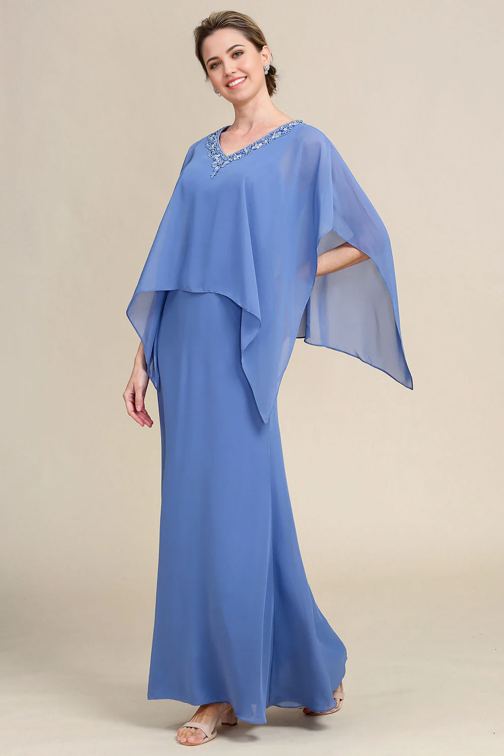 Back view of the sparkly beaded dress, showcasing its elegant drape.