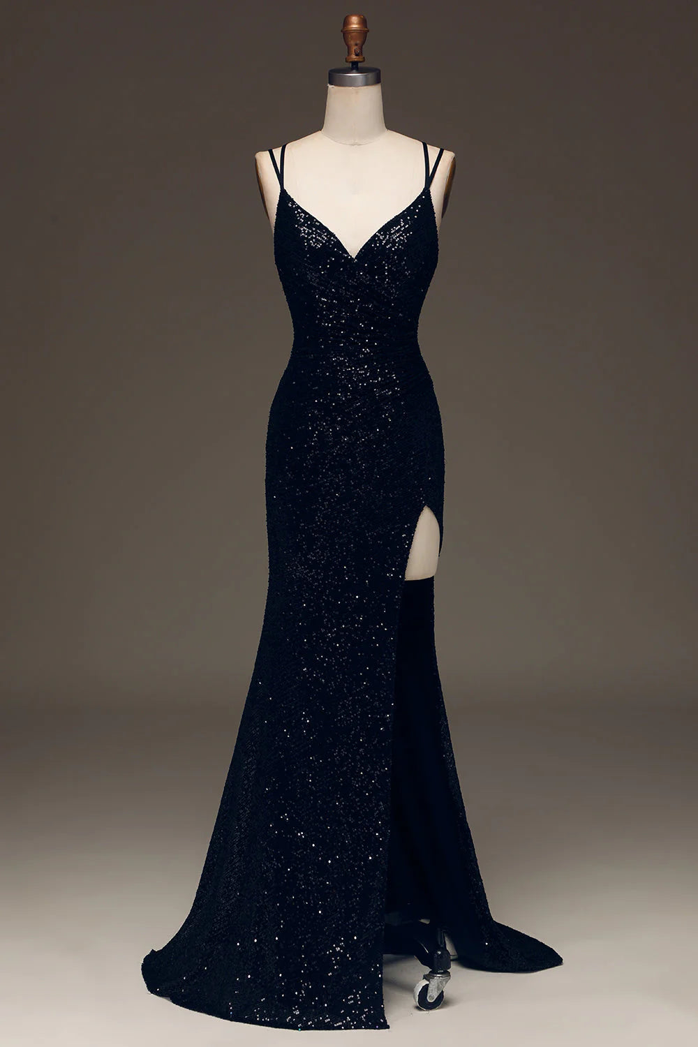 Sparkly black mermaid prom dress with a high slit.