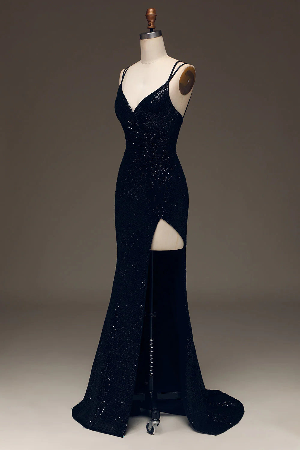 Side view of a sparkly black mermaid prom dress.
