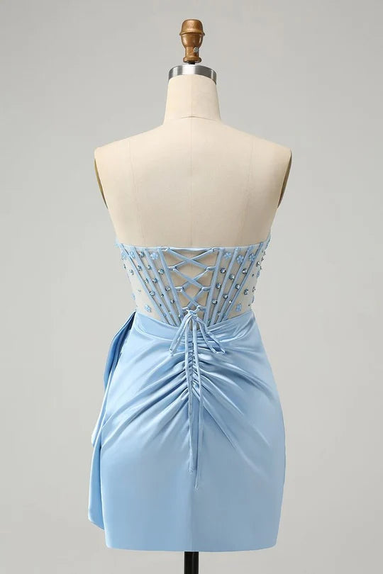 Close-up of the beaded corset and sparkly fabric on a cocktail dress.