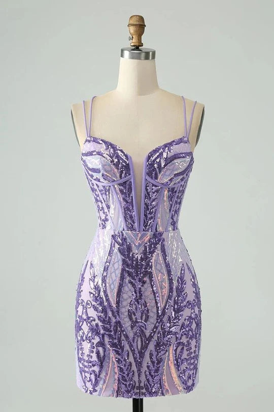 Woman wearing a sparkly bodycon V-neck backless short sequin homecoming dress.