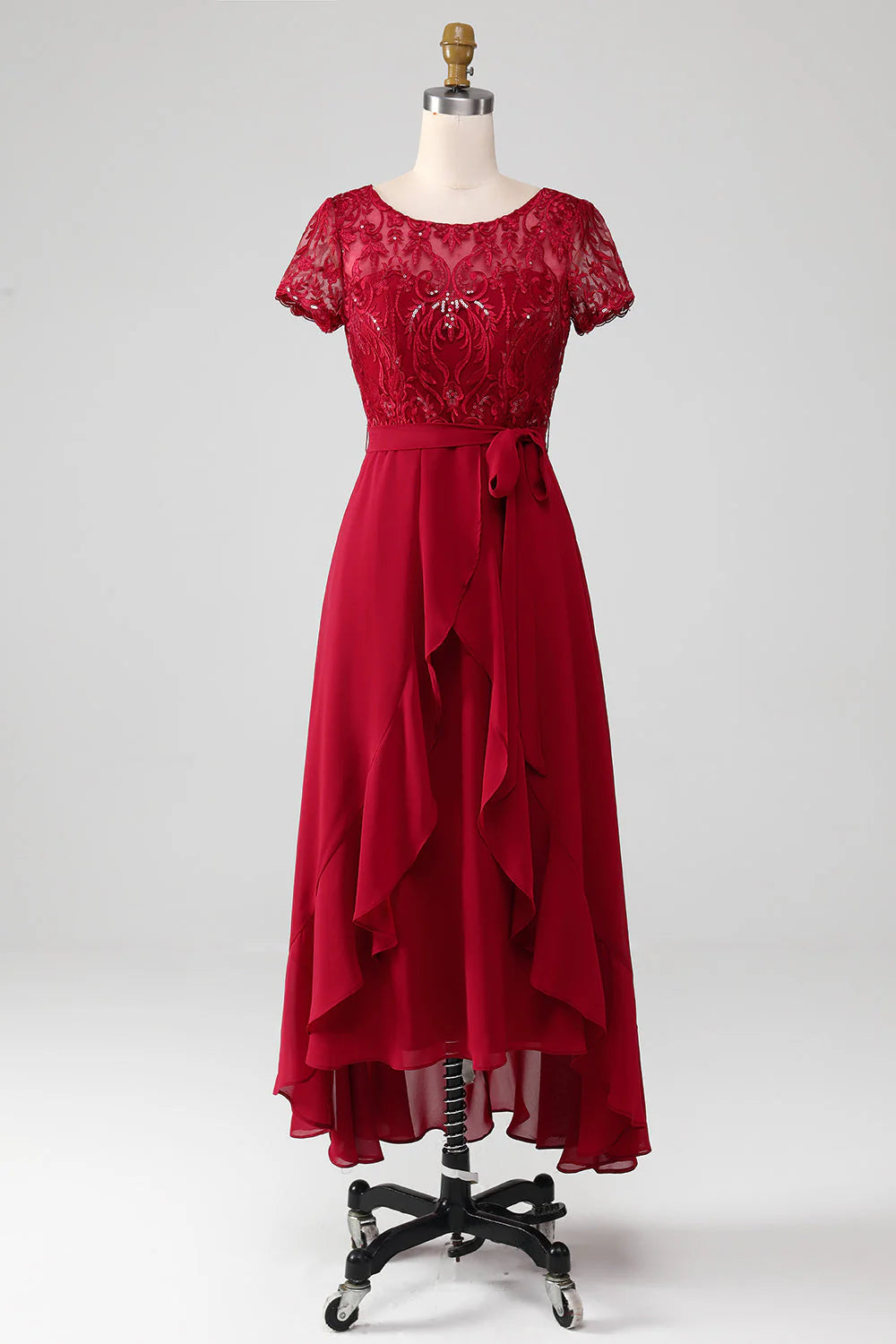 Model wearing the sparkly burgundy formal gown for a wedding occasion.