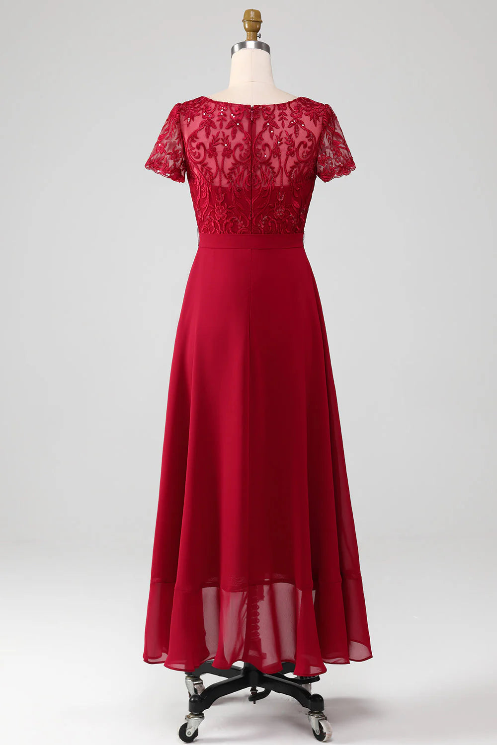 Full length view of the elegant burgundy sequin mother of the bride dress.