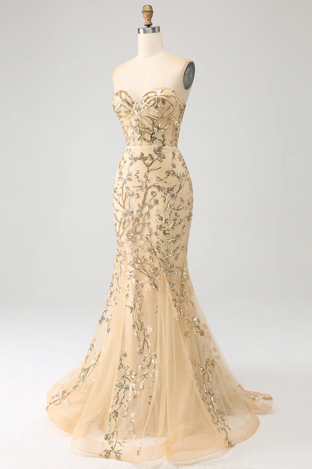 Close-up of the sparkly fabric and corset detail on the champagne mermaid prom dress.