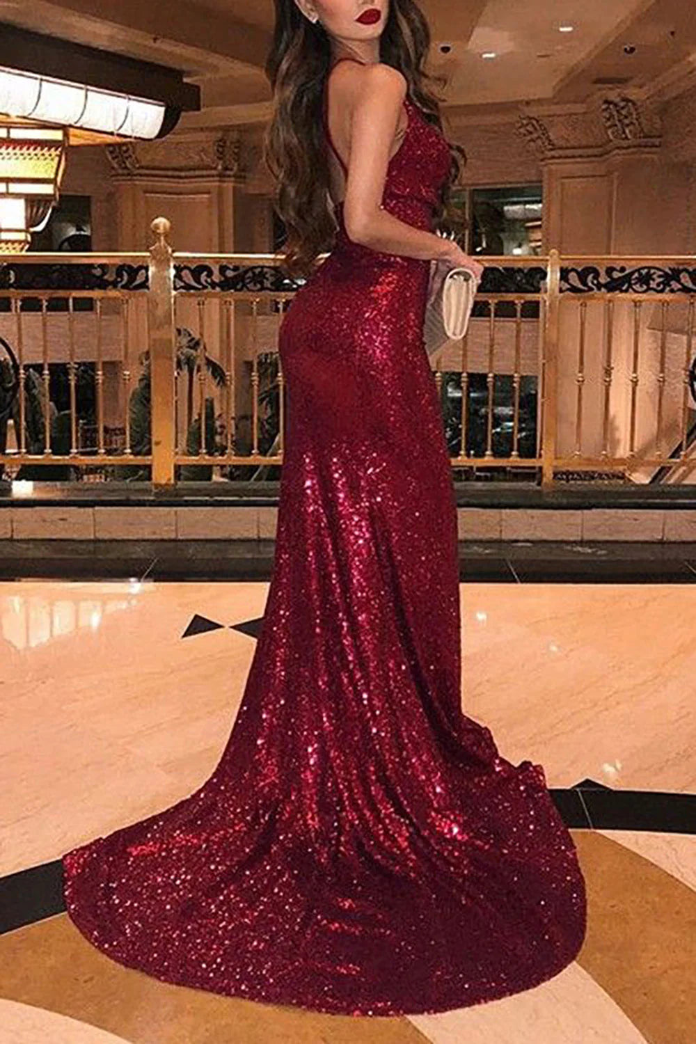 Another view of the sparkly mermaid long prom dress with a high slit.