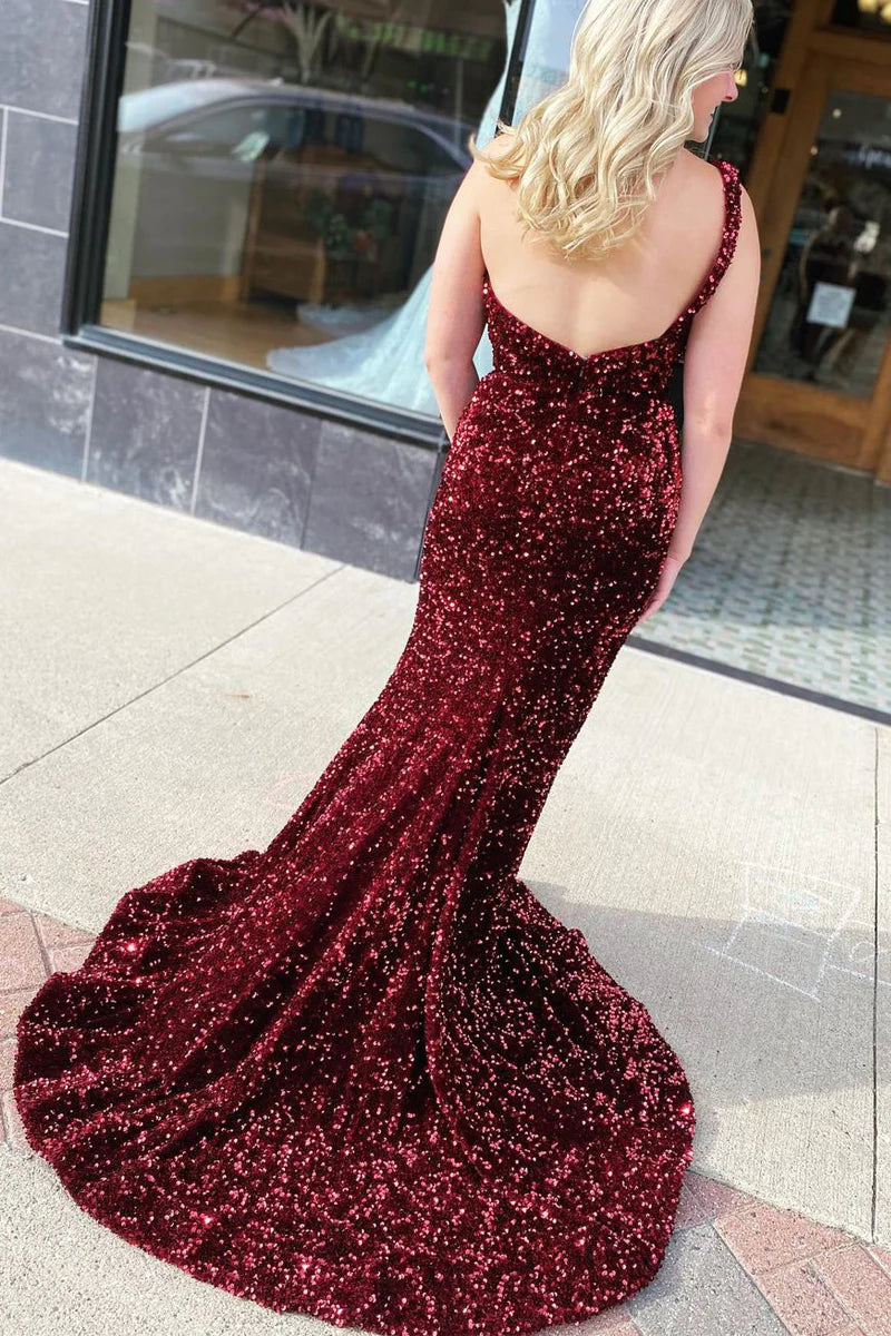 Back view of a sparkly burgundy one-shoulder mermaid gown.