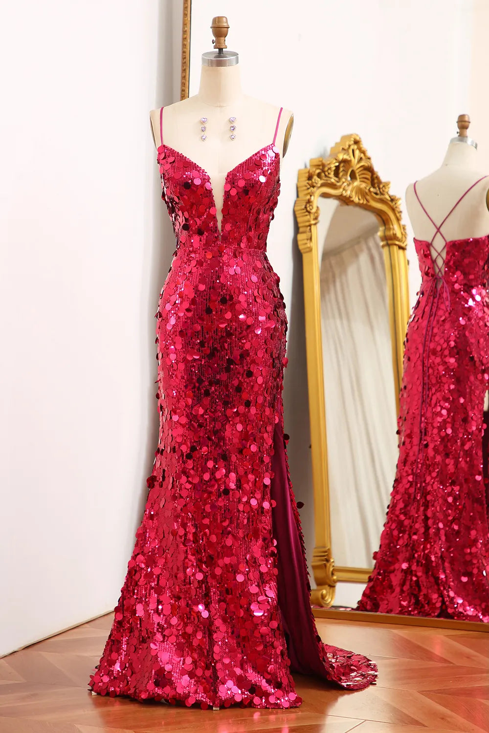 Sparkly mermaid prom dress with spaghetti straps and a split front.