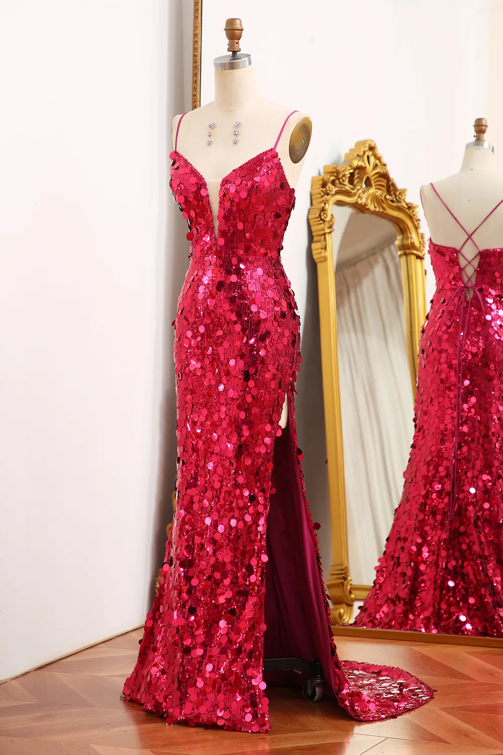 Side view of a sparkly mermaid gown with a high split.