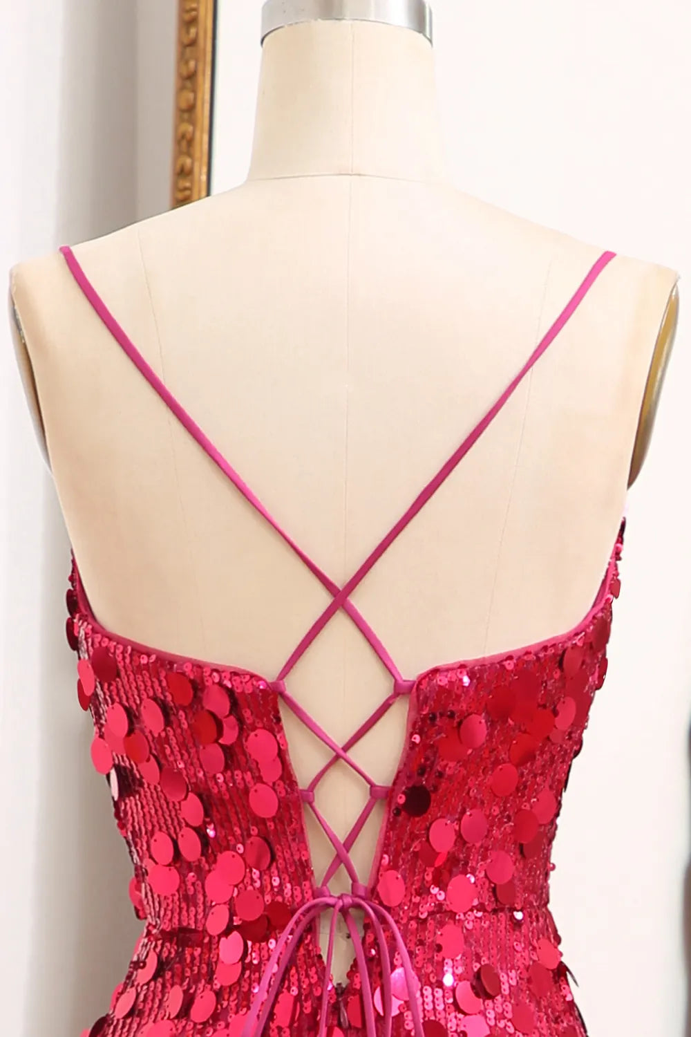 Close-up of sequin detail on a mermaid prom dress.
