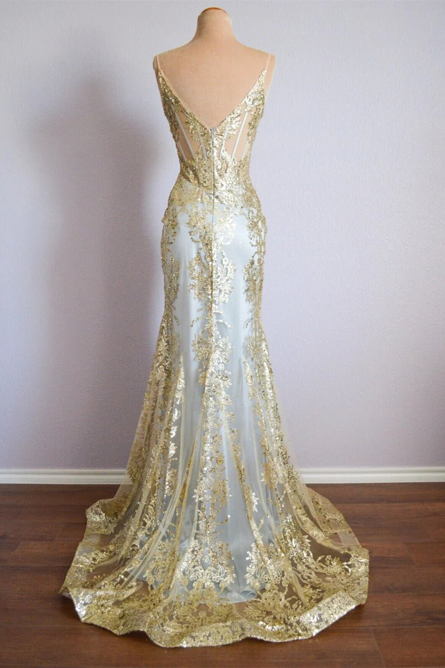 Back view of a sparkly mermaid formal dress with spaghetti straps.