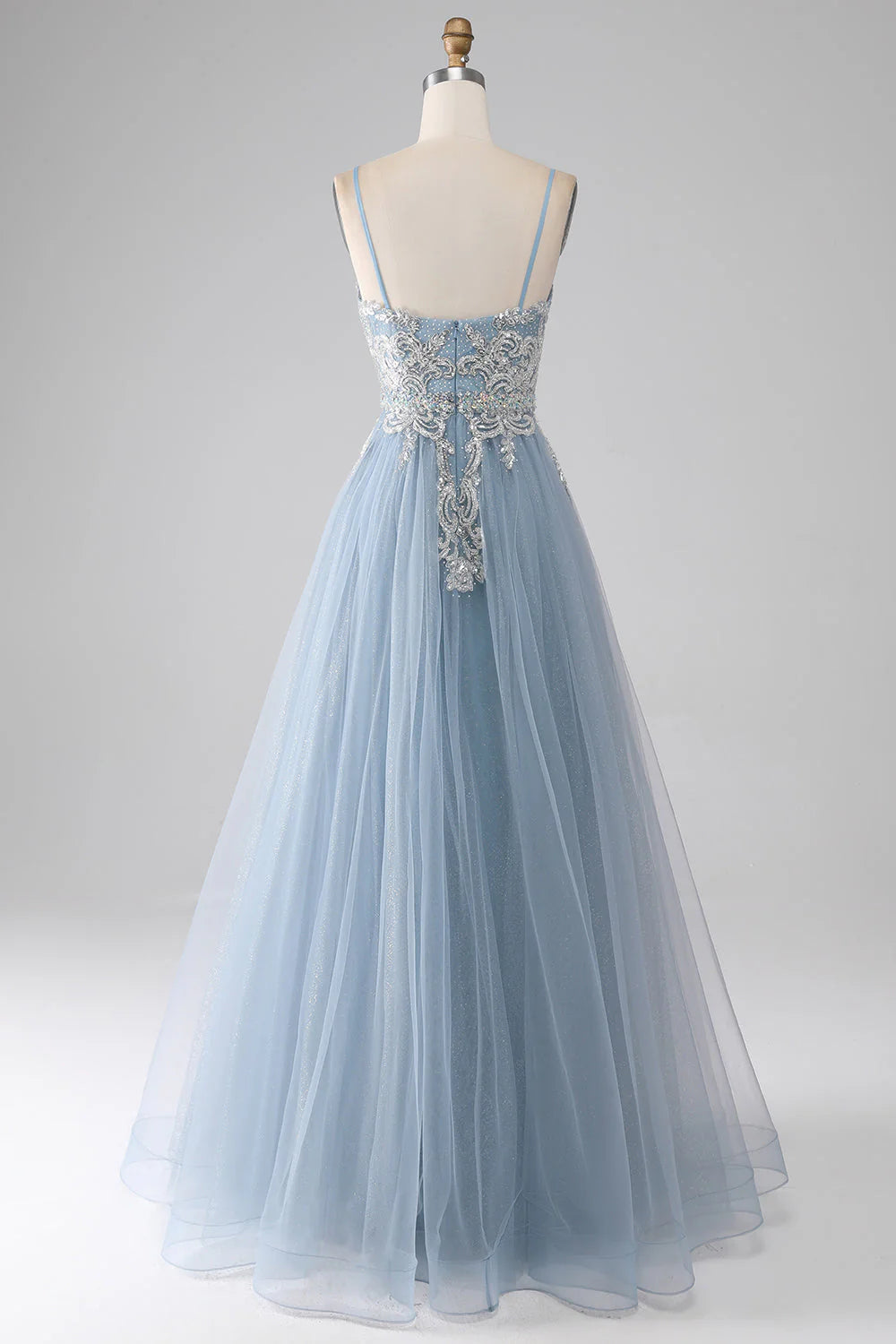 Back view of a model in a shimmering grey-blue sequin mermaid dress.