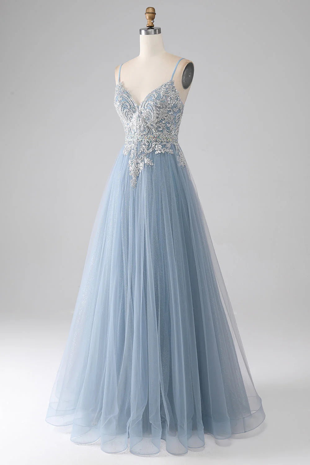 Side profile of a model showcasing the mermaid silhouette of the sequin dress.