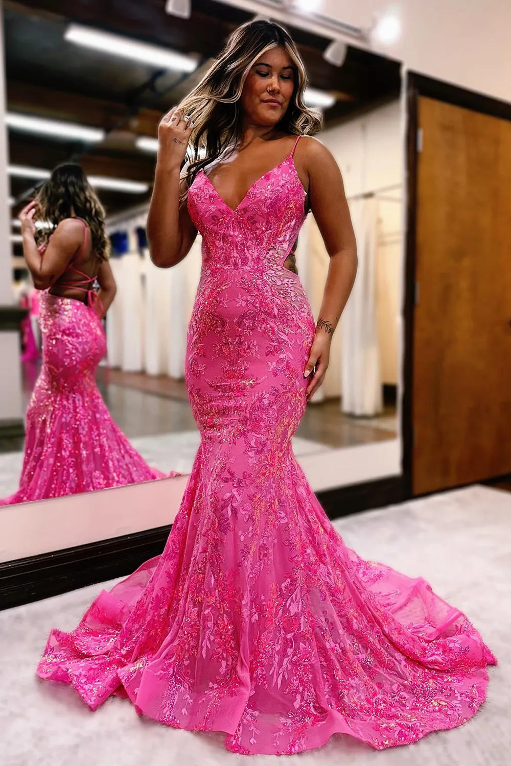 Close-up of the back of the sparkly mermaid sequin prom dress, showing the backless detail.