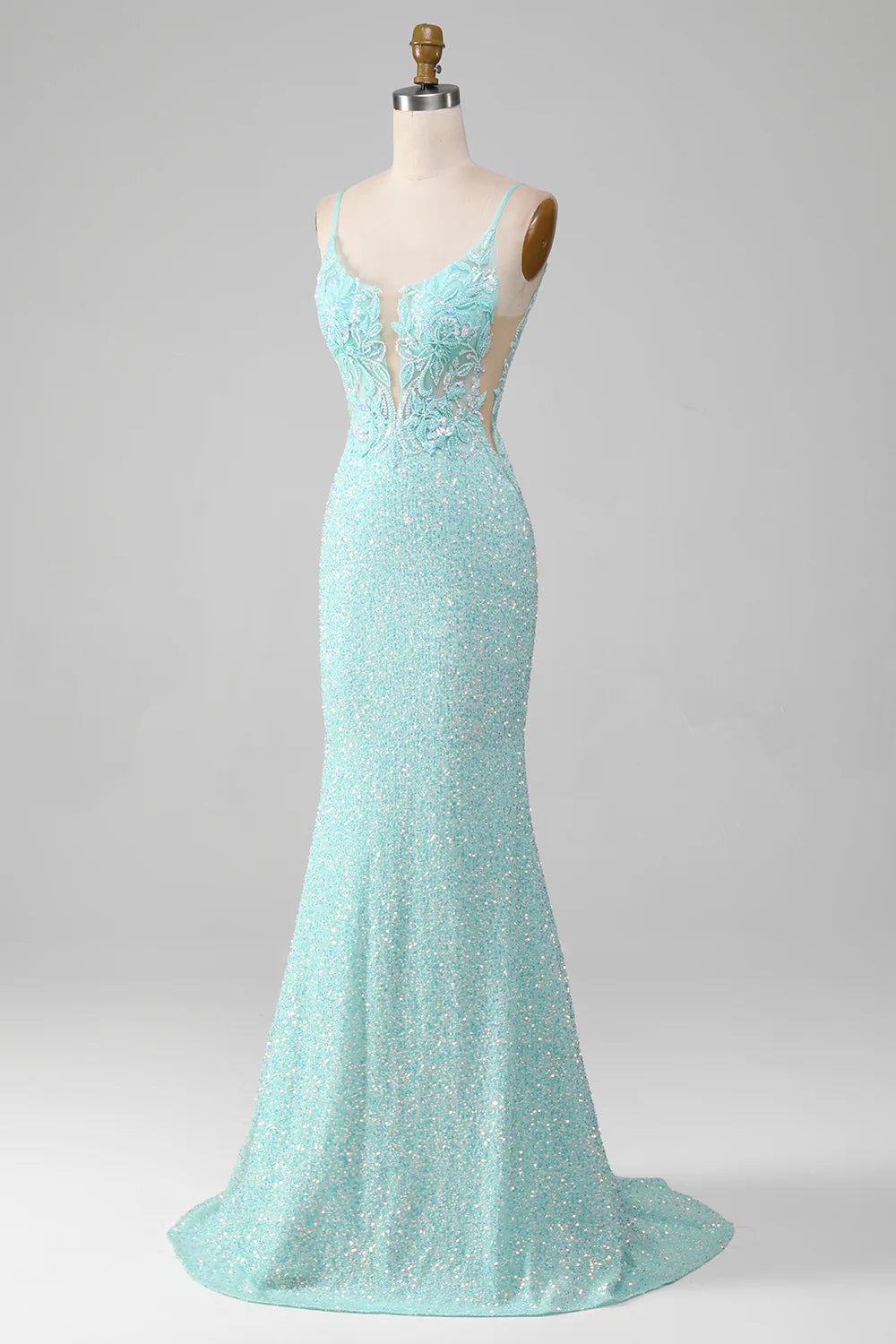 Close-up of the sequin detail on a light green mermaid prom dress.