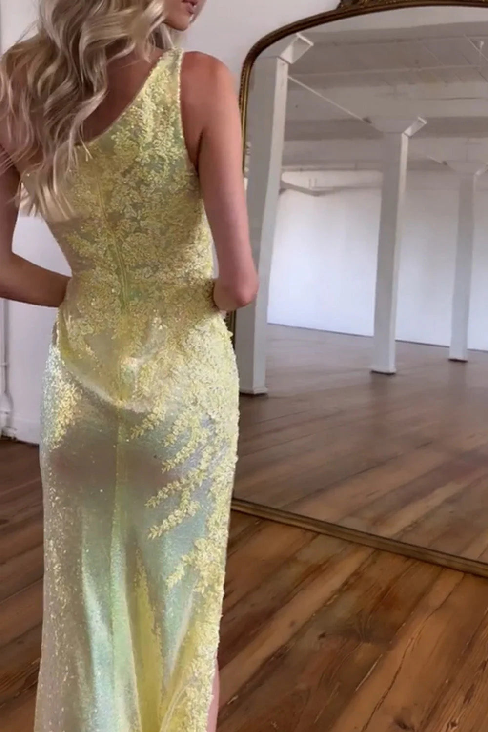 Detail of the sparkly fabric on the one-shoulder formal dress.