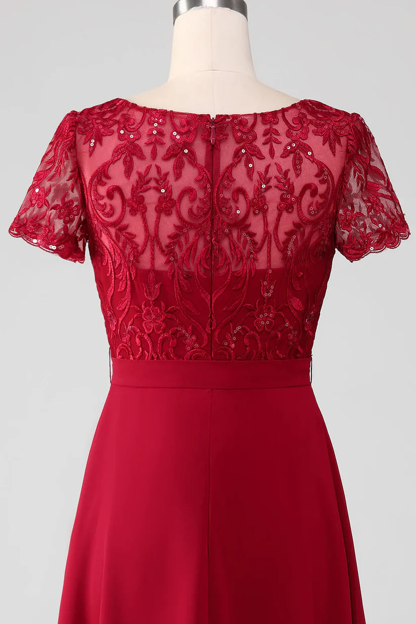 Side view of the V-neck sequin dress, highlighting the asymmetrical design and appliques.