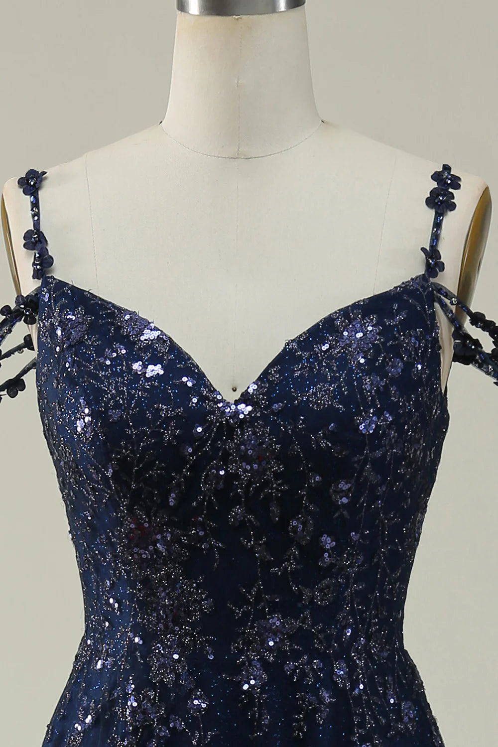 Close-up of the sparkly sequin fabric on the navy ball gown dress.