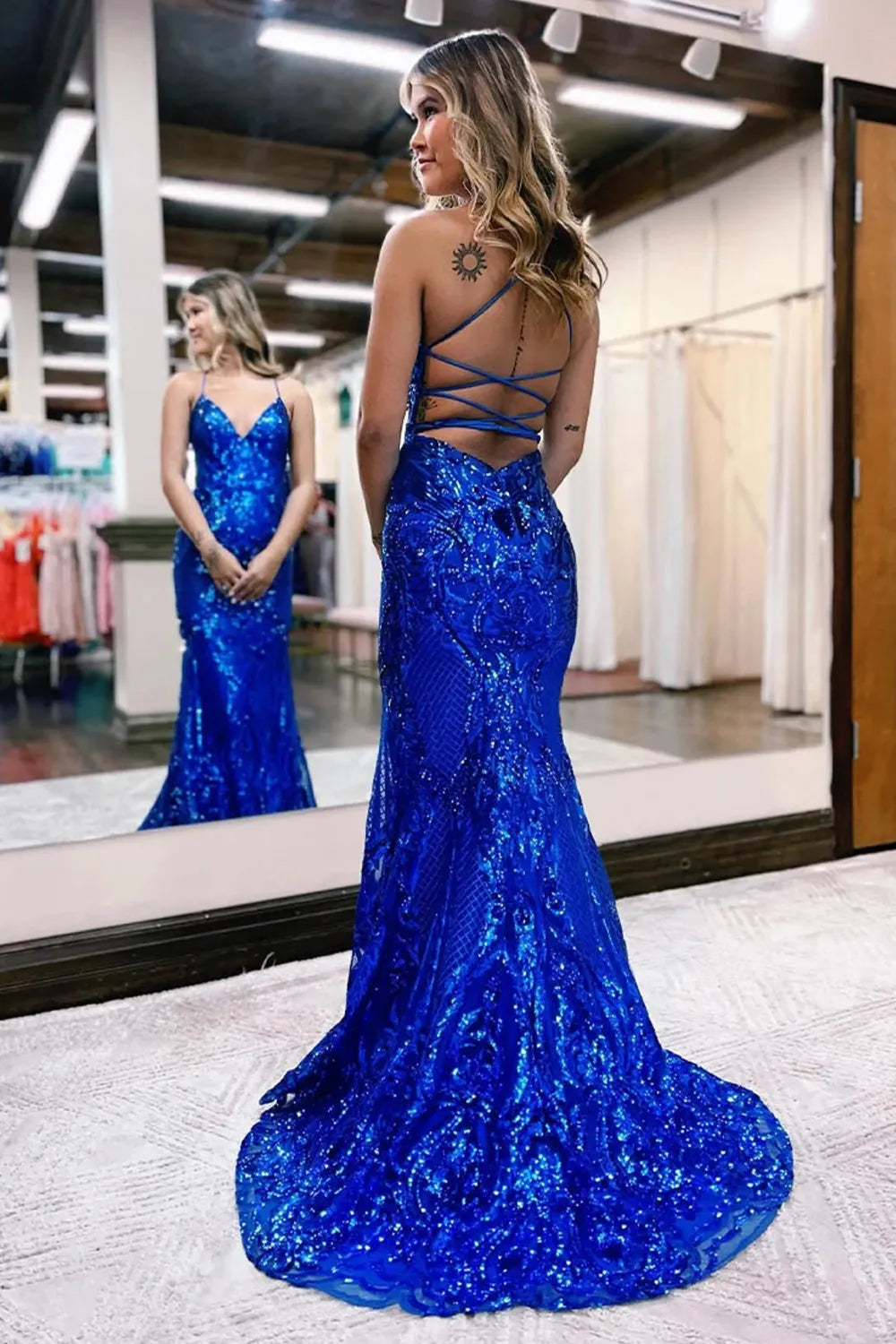 Close-up view of the intricate sparkly sequin embellishments on the mermaid dress.