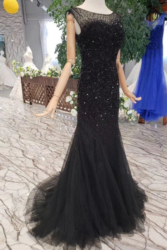 Side view of the sparkly ankle-length mermaid formal gown.