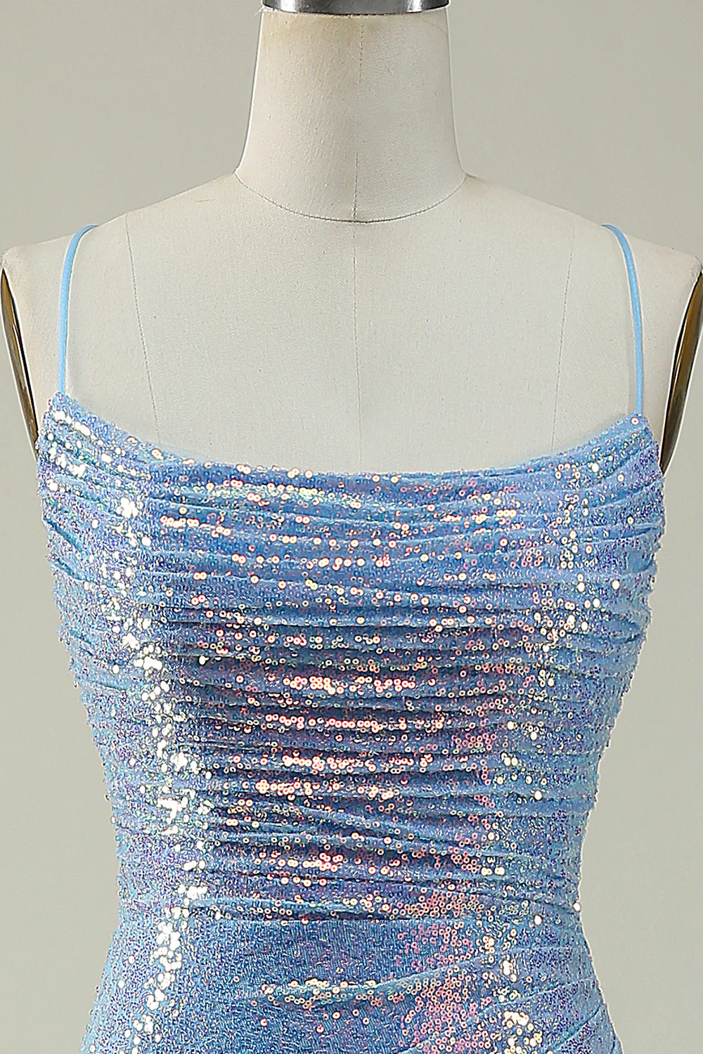 Back view of a dazzling blue sequin long prom dress.