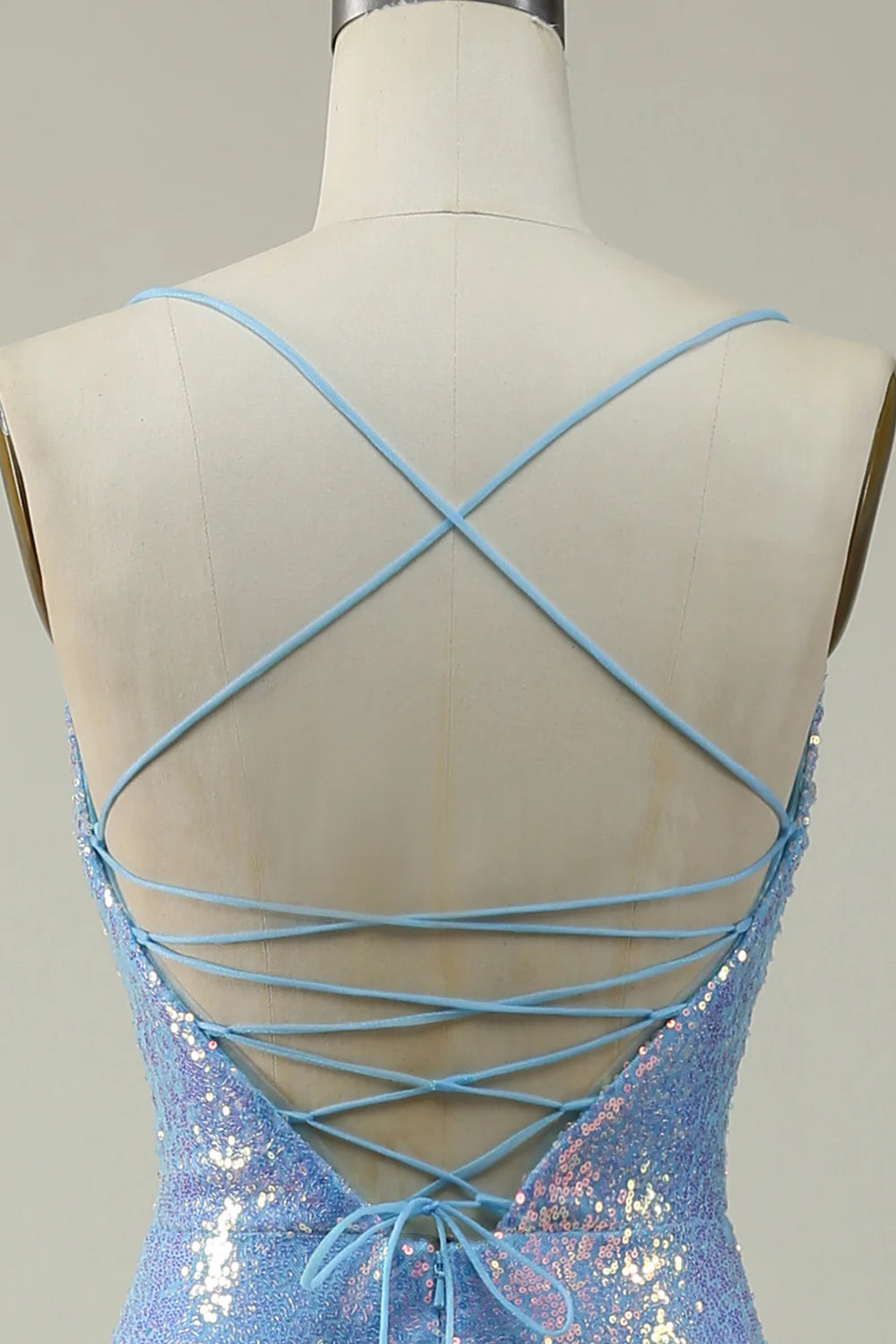 Close-up of the sparkly sequin fabric on a blue prom dress.