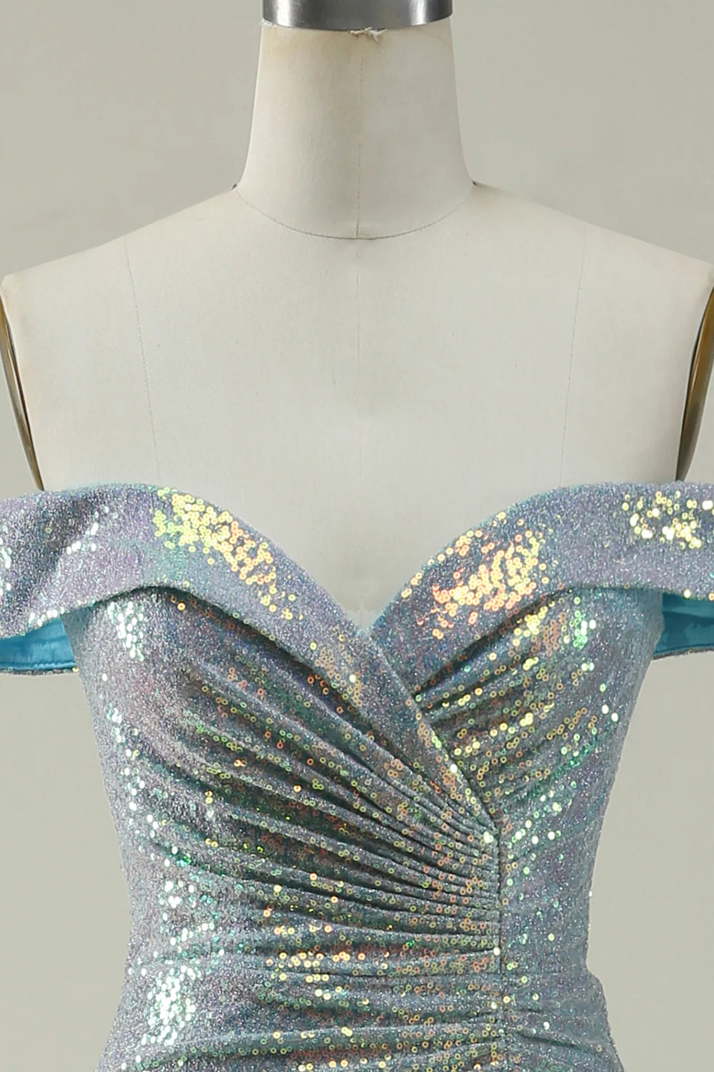 Side view of a blue sequined mermaid prom dress.