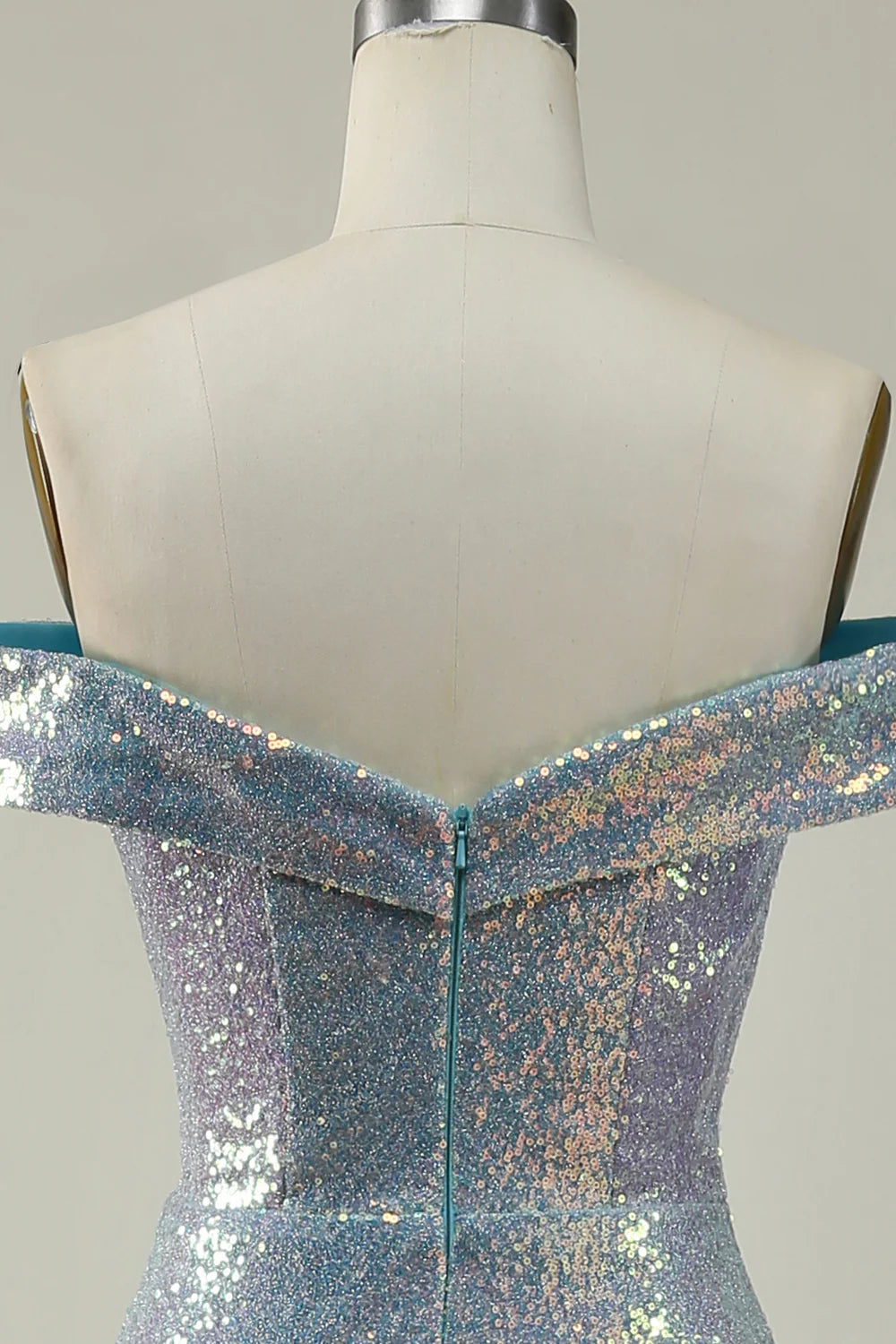 Close-up of the sequin detail on a blue mermaid dress.
